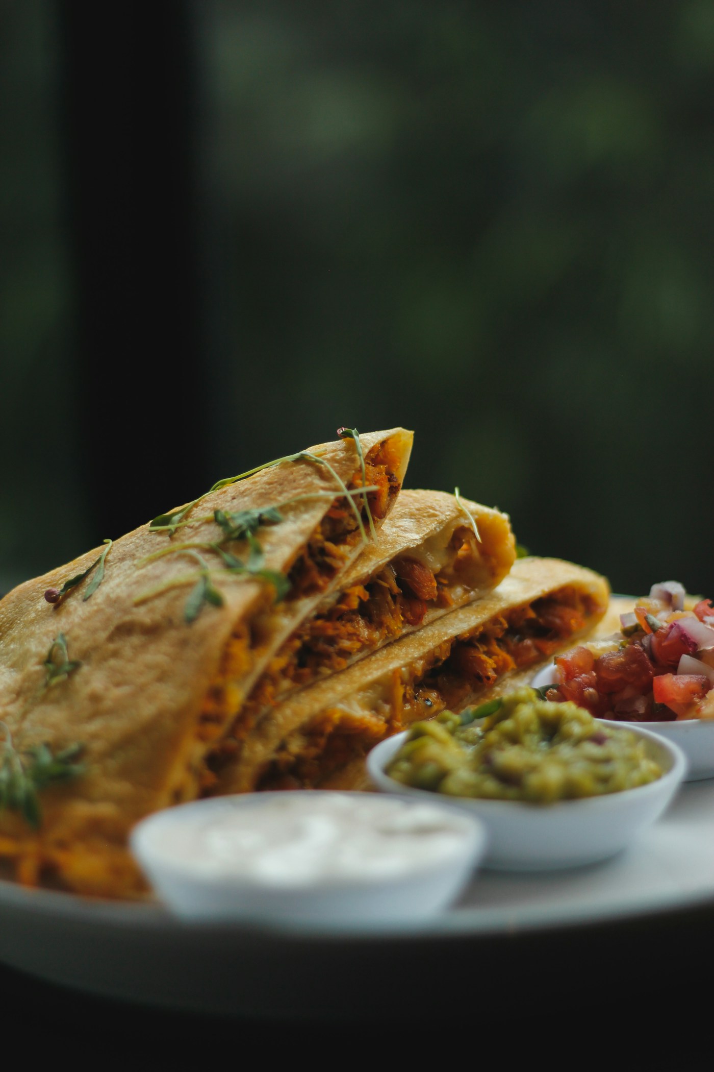 Representative photograph of golden toasted quesadilla wedges